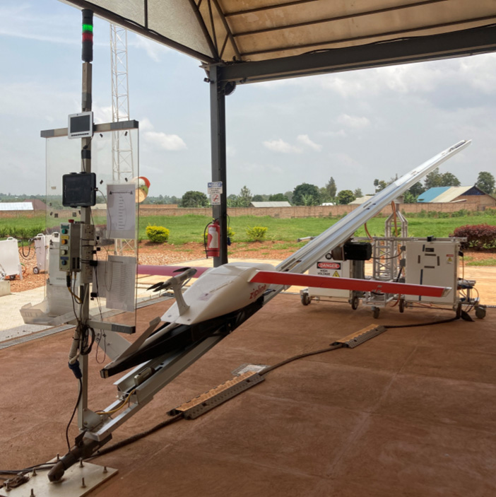 Large Starbucks logo on a wooden wall inside the store, with “TZ” initials and soft lighting.