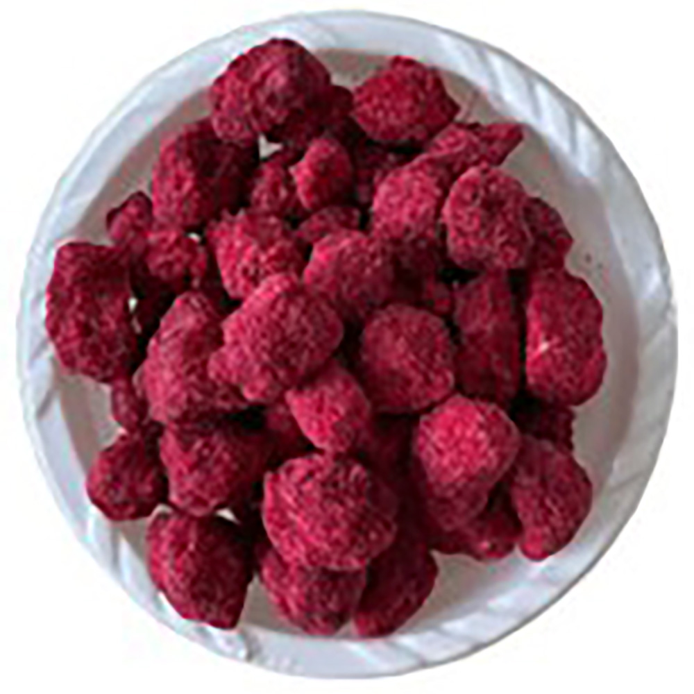 真っ赤なバオバブコーティングのお菓子「マブユ」が入った白いボウル。