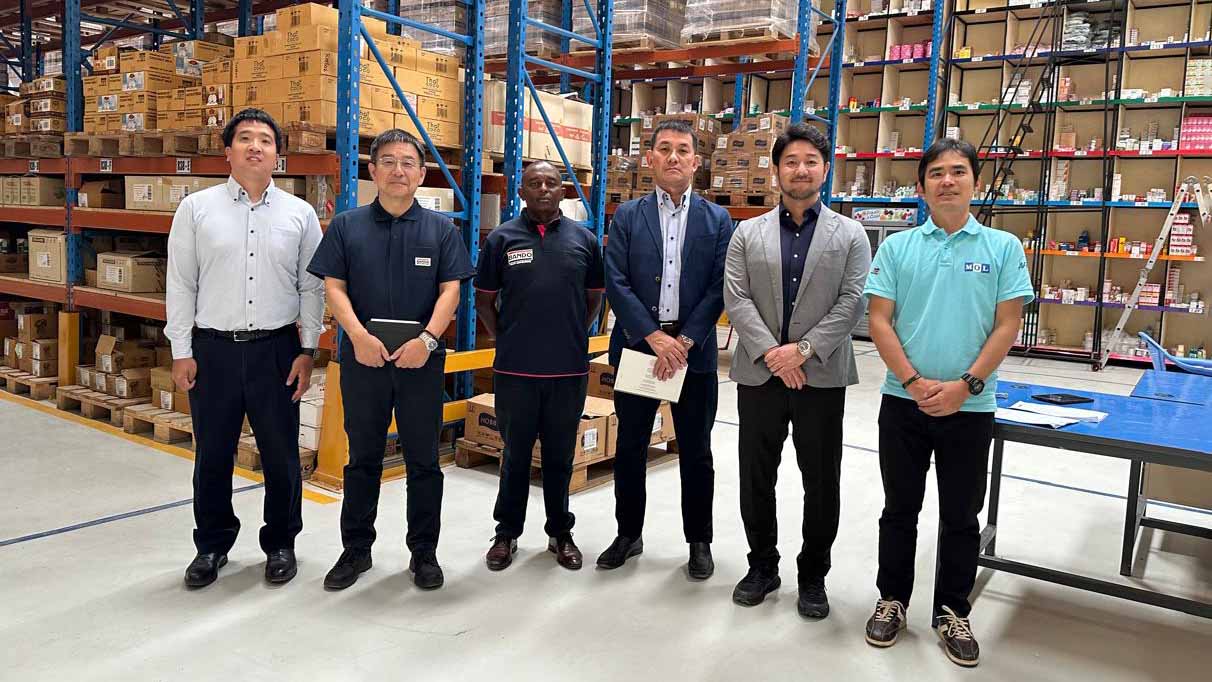 Public minibus decorated for Christmas, heavily loaded with luggage as people travel upcountry in Kenya during the holiday season.