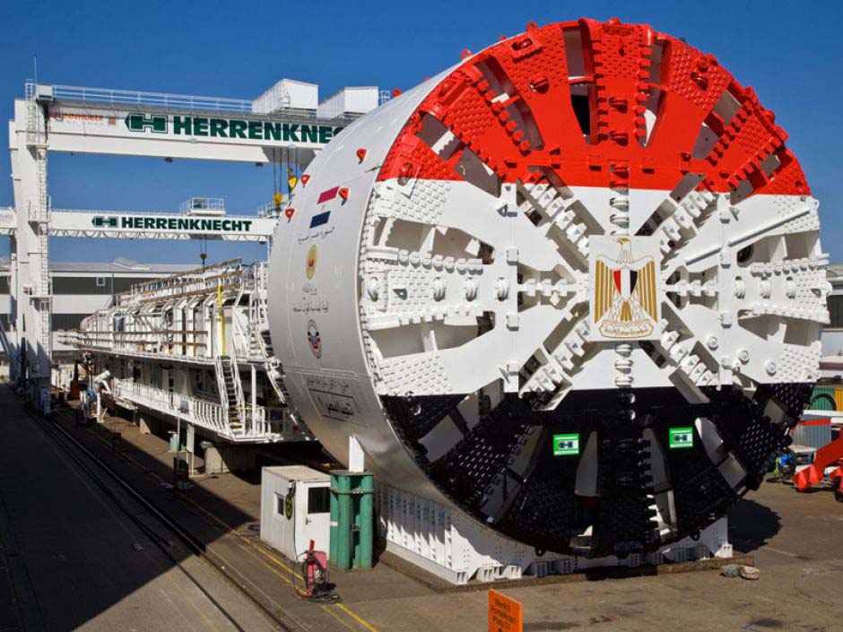 A large tunnel-boring machine bearing Egypt’s coat of arms at a Herrenknecht facility.