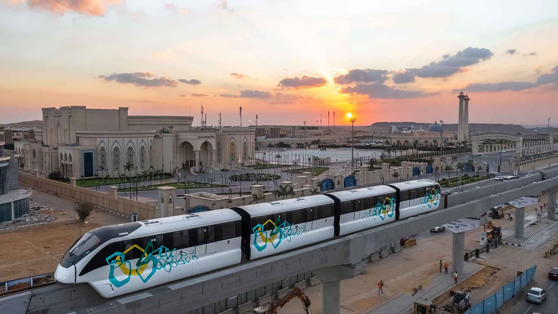 A modern monorail train travelling through Egypt’s New Administrative Capital at sunset.