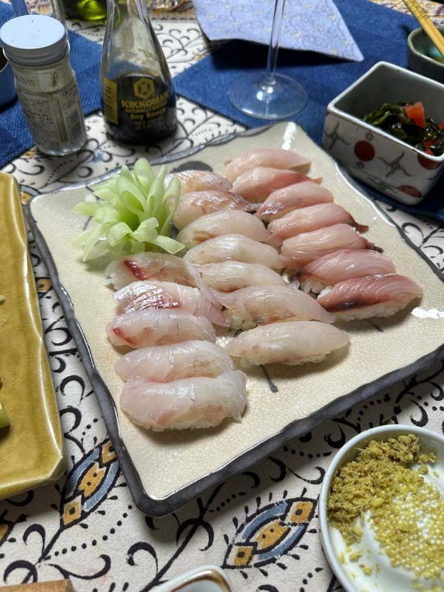 Fresh local fish being prepared as tempura in the JICA Kitchen Car during a community activity in Mauritius.